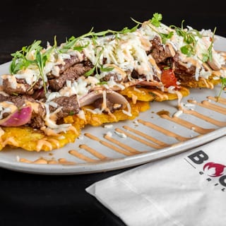 Fried Green Plantains With Wok Smoked Lomo Steak