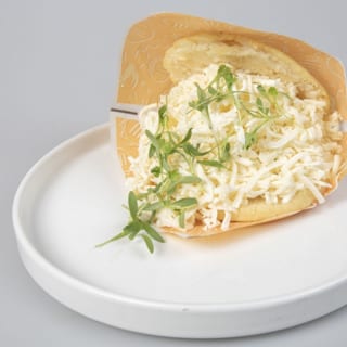Arepa with Shredded white cheese