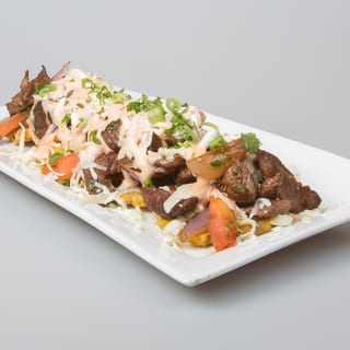 Fried Green Plantains With Wok Smoked Lomo Steak
