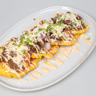 Fried Green Plantains With Wok Smoked Lomo Steak